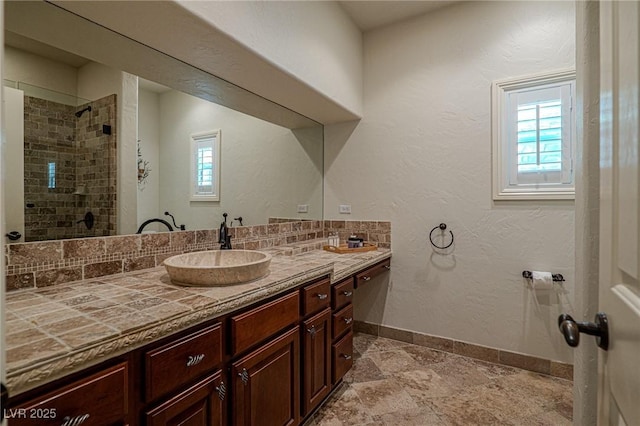 11814 Canons Brook Dr, Las Vegas, NV 89141 - full bathroom featuring a sink, baseboards, double vanity, and plenty of natural light