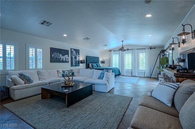 11814 Canons Brook Dr, Las Vegas, NV 89141 - living room featuring a textured ceiling, visible vents, lofted ceiling, and recessed lighting