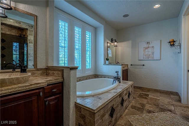 11814 Canons Brook Dr, Las Vegas, NV 89141 - full bathroom featuring a textured wall, recessed lighting, vanity, and a bath