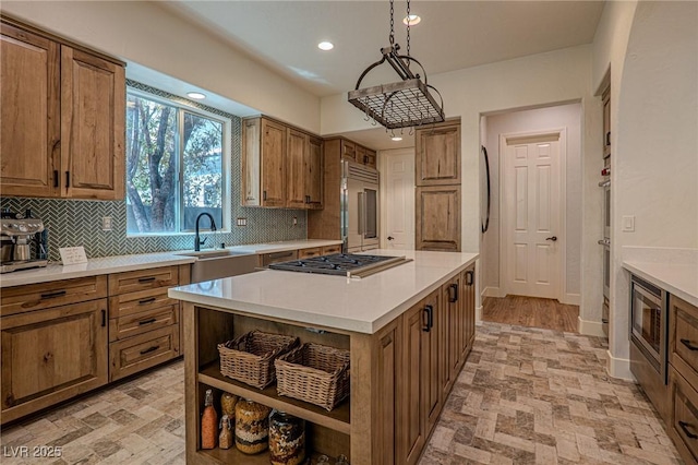 11814 Canons Brook Dr, Las Vegas, NV 89141 - kitchen with open shelves, built in appliances, a sink, brown cabinetry, and backsplash