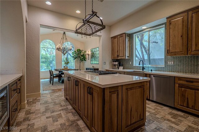 11814 Canons Brook Dr, Las Vegas, NV 89141 - kitchen featuring a sink, tasteful backsplash, plenty of natural light, and stainless steel appliances