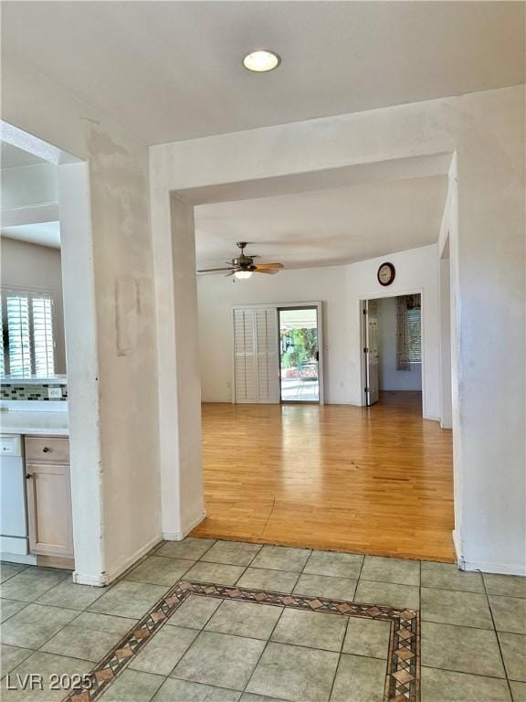 unfurnished room featuring light wood-type flooring, recessed lighting, ceiling fan, and plenty of natural light