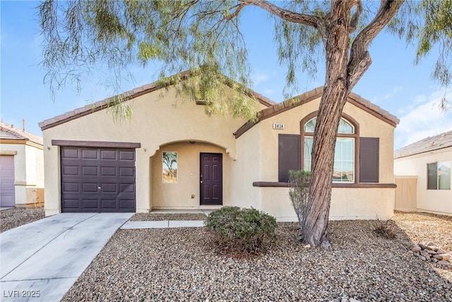 3434 Denali Preserve St, Las Vegas, NV 89122 - mediterranean / spanish house with an attached garage, driveway, and stucco siding