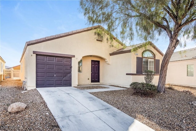 3434 Denali Preserve St, Las Vegas, NV 89122 - view of front facade featuring concrete driveway, stucco siding, fence, and an attached garage