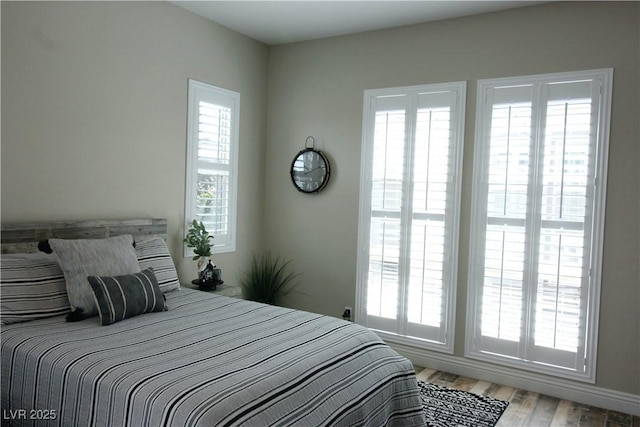 bedroom with light wood finished floors