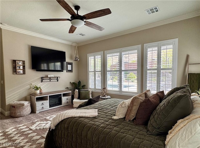 carpeted bedroom with crown molding, a ceiling fan, and visible vents