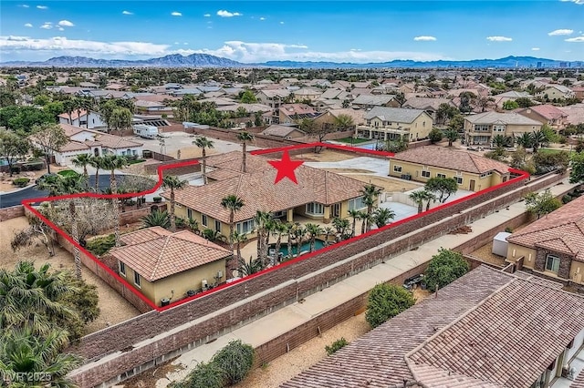 drone / aerial view featuring a mountain view and a residential view