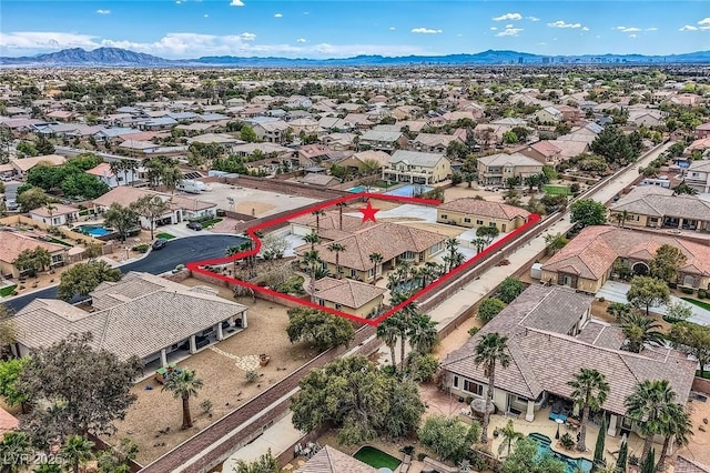 birds eye view of property with a residential view and a mountain view