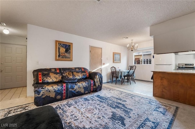 528 Close Ave, Henderson, NV 89011 - living area with a textured ceiling, an inviting chandelier, and visible vents