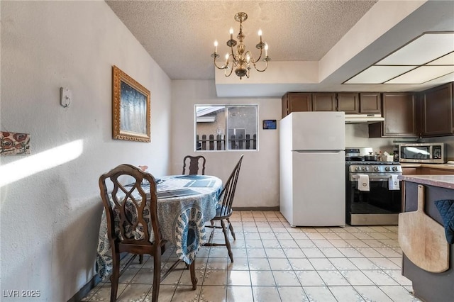 528 Close Ave, Henderson, NV 89011 - kitchen with a textured ceiling, appliances with stainless steel finishes, a chandelier, and under cabinet range hood