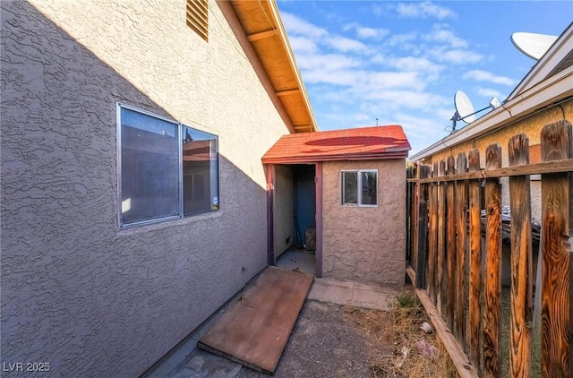 528 Close Ave, Henderson, NV 89011 - view of side of home with fence and stucco siding