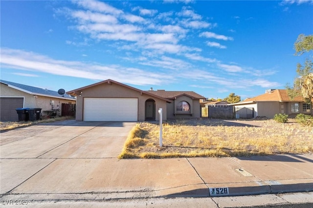 528 Close Ave, Henderson, NV 89011 - ranch-style house with concrete driveway, stucco siding, fence, and an attached garage