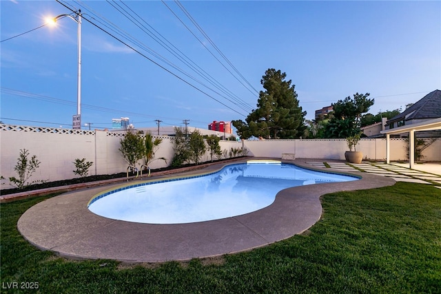 view of swimming pool with a patio area, a fenced backyard, a fenced in pool, and a lawn