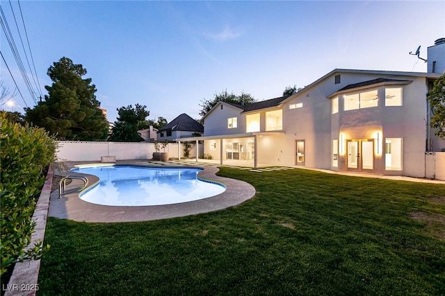 view of pool with a yard, a fenced backyard, a fenced in pool, and a patio area