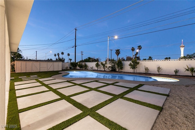 view of pool featuring an outbuilding, a fenced backyard, a patio, a jacuzzi, and a fenced in pool