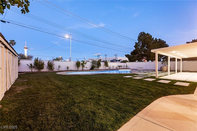 view of yard featuring a patio, a fenced backyard, and a fenced in pool
