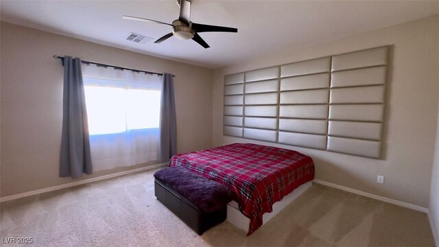 carpeted bedroom with baseboards and a ceiling fan