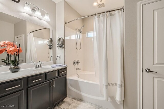 full bathroom featuring vanity and shower / tub combo