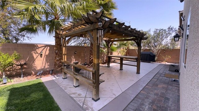 view of patio / terrace featuring a pergola and a fenced backyard