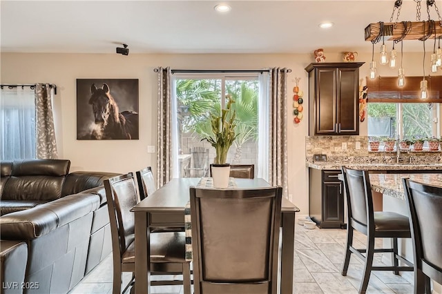 dining room with plenty of natural light and recessed lighting