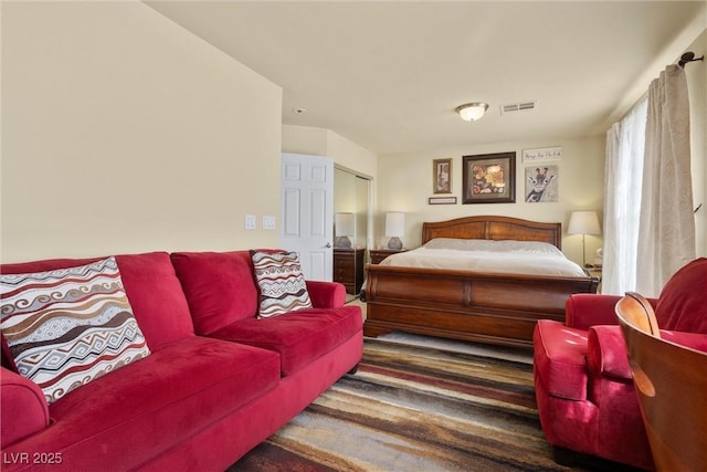 bedroom featuring visible vents and carpet floors