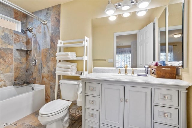 full bathroom featuring toilet, vanity, and  shower combination