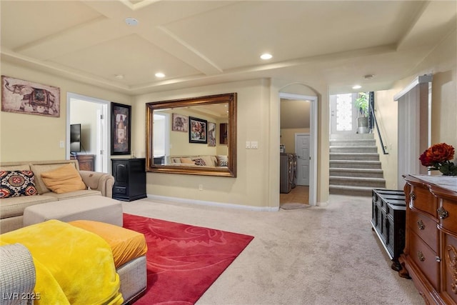 living room with baseboards, recessed lighting, stairs, independent washer and dryer, and light colored carpet