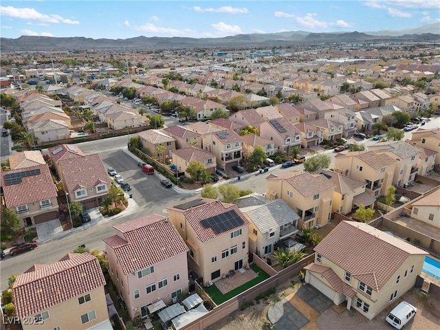 birds eye view of property featuring a mountain view and a residential view