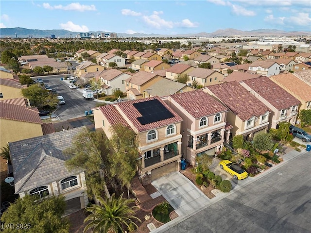 birds eye view of property with a residential view and a mountain view