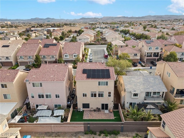 birds eye view of property with a residential view and a mountain view