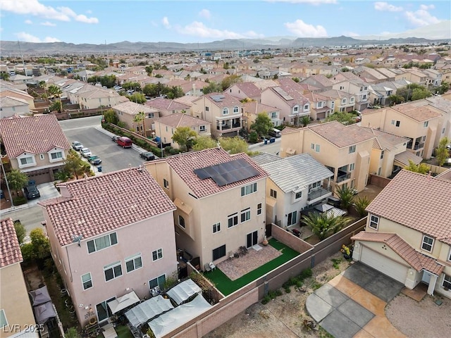drone / aerial view featuring a mountain view and a residential view