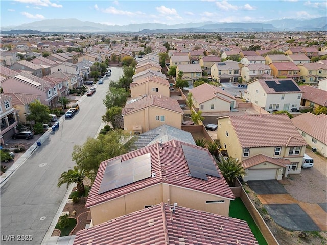birds eye view of property with a mountain view and a residential view