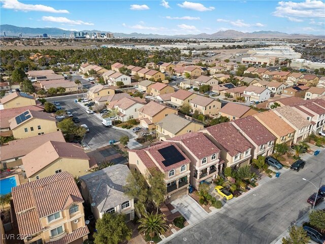 bird's eye view with a residential view and a mountain view