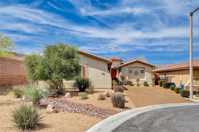 11342 Early Sun Ct, Las Vegas, NV 89135 - mediterranean / spanish home featuring a tiled roof, stucco siding, and fence