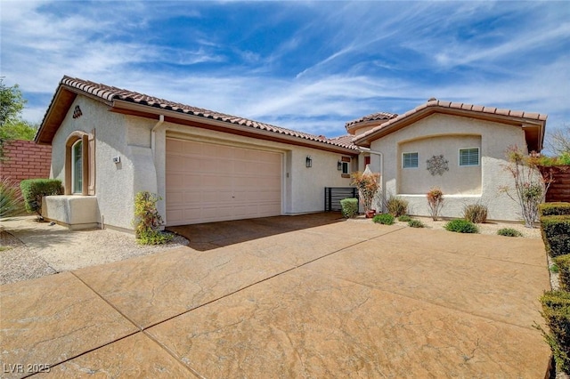 11342 Early Sun Ct, Las Vegas, NV 89135 - mediterranean / spanish home with a tiled roof, a garage, driveway, and stucco siding
