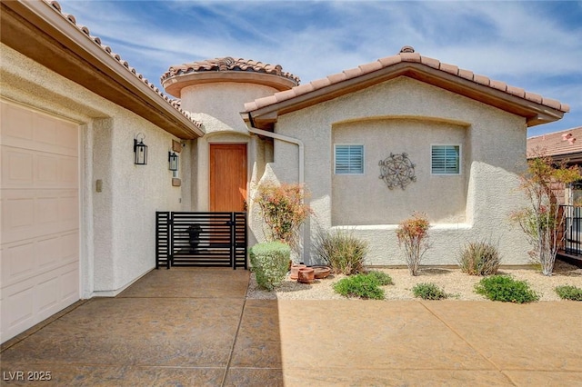 11342 Early Sun Ct, Las Vegas, NV 89135 - property entrance with a tile roof, an attached garage, and stucco siding