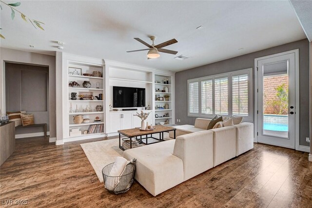 11342 Early Sun Ct, Las Vegas, NV 89135 - living room with visible vents, a ceiling fan, plenty of natural light, and wood finished floors