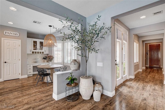 11342 Early Sun Ct, Las Vegas, NV 89135 - entryway featuring visible vents, baseboards, and wood finished floors