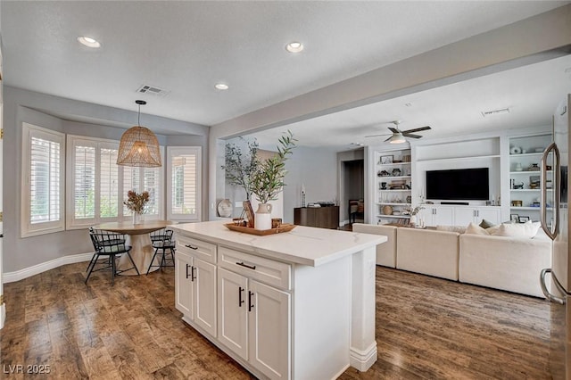 11342 Early Sun Ct, Las Vegas, NV 89135 - kitchen featuring white cabinets, recessed lighting, pendant lighting, and a kitchen island