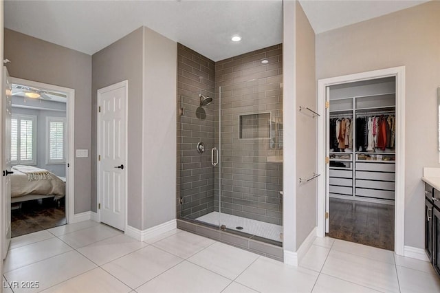 11342 Early Sun Ct, Las Vegas, NV 89135 - bathroom featuring tile patterned flooring, baseboards, and a stall shower