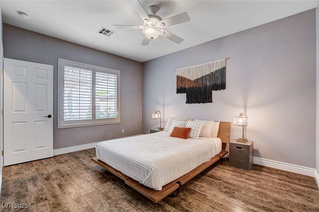 11342 Early Sun Ct, Las Vegas, NV 89135 - bedroom featuring visible vents, baseboards, ceiling fan, and wood finished floors