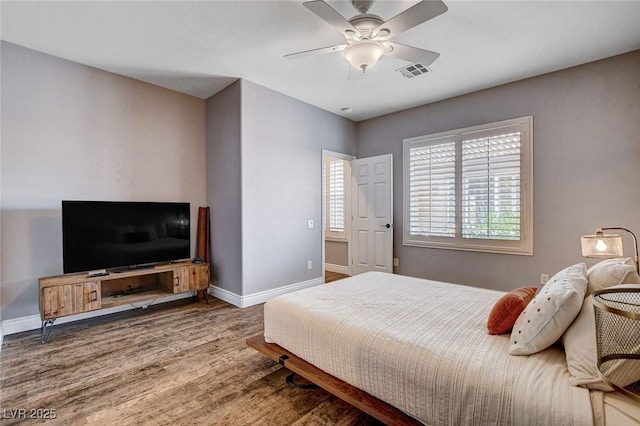 11342 Early Sun Ct, Las Vegas, NV 89135 - bedroom featuring visible vents, baseboards, ceiling fan, and wood finished floors