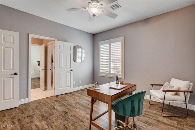 11342 Early Sun Ct, Las Vegas, NV 89135 - home office featuring wood finished floors, ceiling fan, baseboards, and visible vents