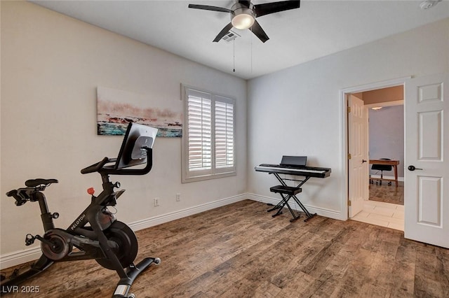 11342 Early Sun Ct, Las Vegas, NV 89135 - workout area featuring visible vents, baseboards, a ceiling fan, and wood finished floors