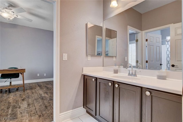 11342 Early Sun Ct, Las Vegas, NV 89135 - bathroom with vanity, baseboards, and a ceiling fan