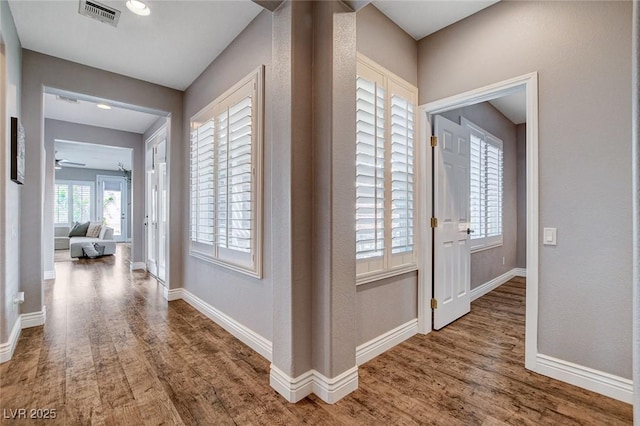 11342 Early Sun Ct, Las Vegas, NV 89135 - hallway featuring visible vents, baseboards, and wood finished floors