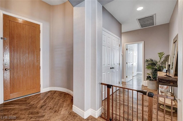 11342 Early Sun Ct, Las Vegas, NV 89135 - entrance foyer with visible vents, baseboards, and wood finished floors