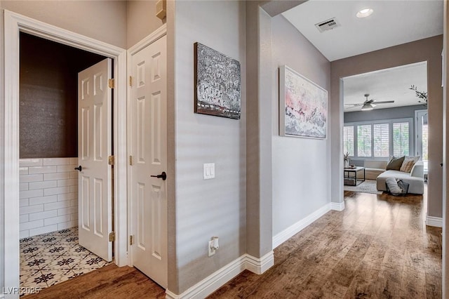11342 Early Sun Ct, Las Vegas, NV 89135 - hallway featuring visible vents, baseboards, and wood finished floors