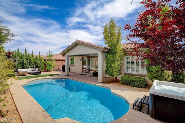 11342 Early Sun Ct, Las Vegas, NV 89135 - rear view of house featuring a patio, outdoor lounge area, a hot tub, a tile roof, and fence