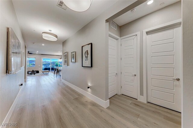 93 Reverie Heights Ave, Henderson, NV 89011 - corridor featuring light wood-type flooring, baseboards, and visible vents